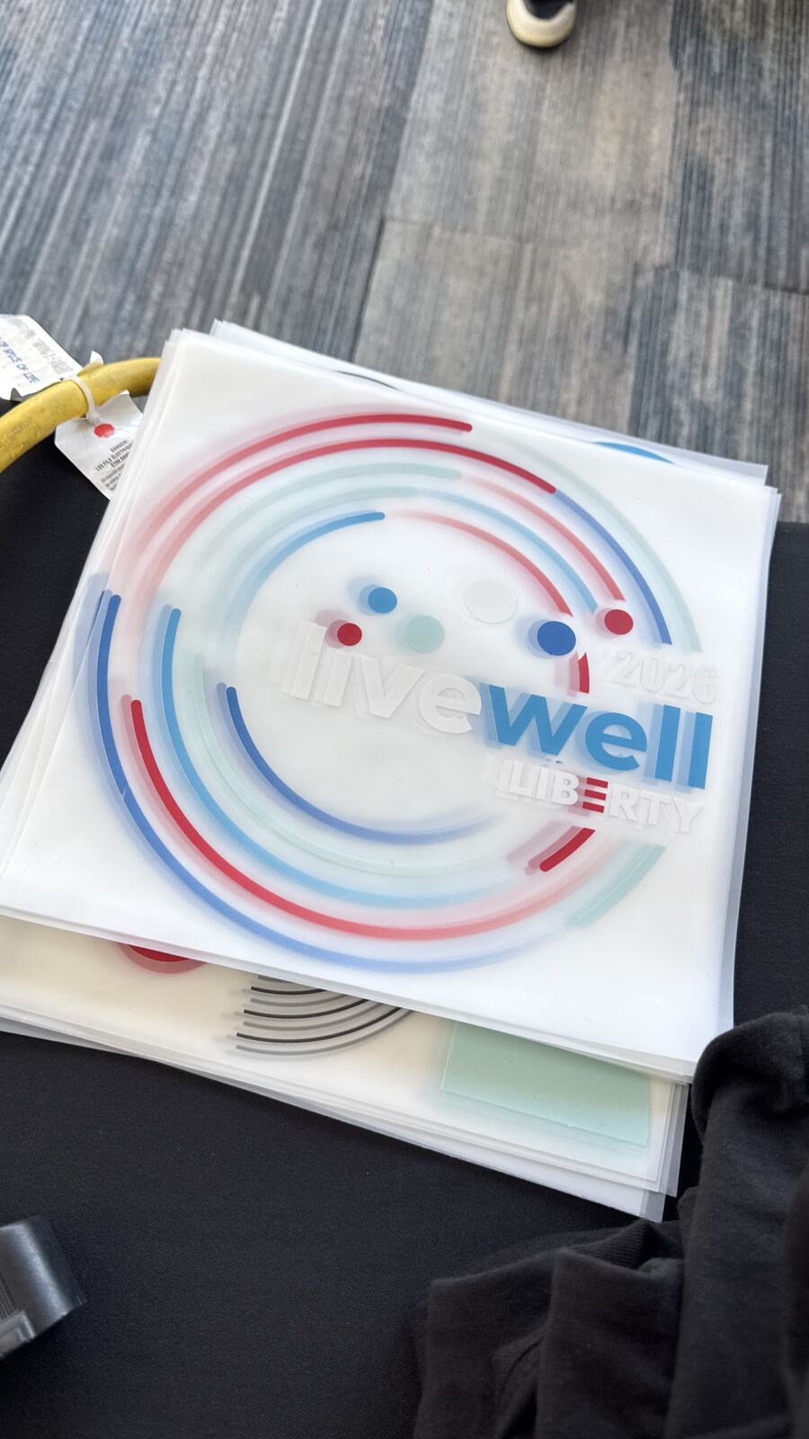 Close-up of a branded lanyard and wristband from a live event
